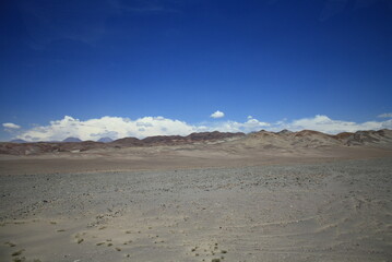 Landscape Or Mountains, sand, volcano And clounds At Atacama Desert In Chile