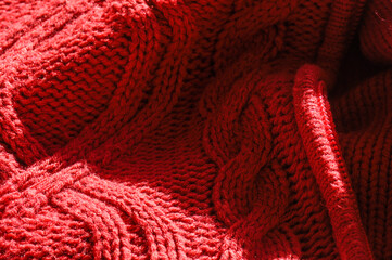 Closeup of the details and textures of a red coat made from sheep's wool © Marquicio