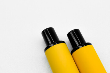 Obraz premium Modern electronic cigarettes on a white background. Fashionable smoking device. E-cigarette for vaping. Trendy vape pod. Selective focus