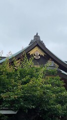 Beautiful ridge of rooftop with central decor pieces, Sakura petals as their family crest “Kamon” delicately designed “Yushima Tenjin” enshrinement established in year 458, Ueno Tokyo, photo 2022/6/14