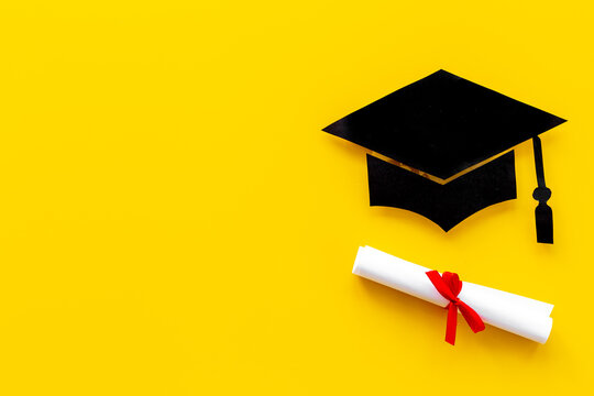 Black mortarboard graduation cap paper cut with diploma. Education concept