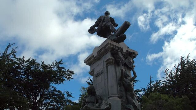 Panning Statue Of Ferdinand Magellan In Park Under Clouds In Sky - Punta Arenas, Chile