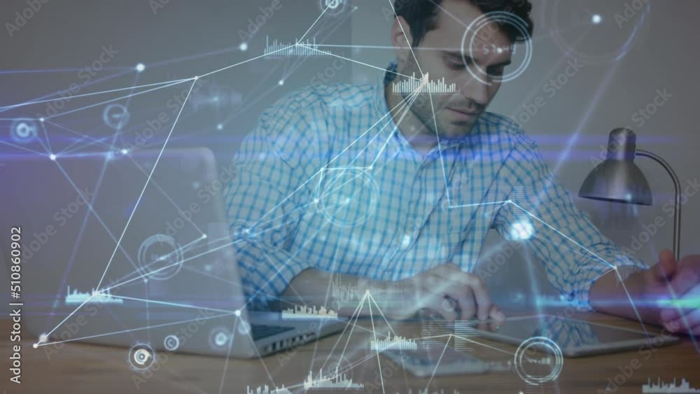 Wall mural network of connections and data processing against caucasian man using laptop and digital tablet