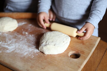 person kneading dough