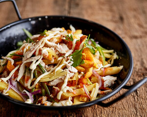 Shredded chicken with fries and green onions 