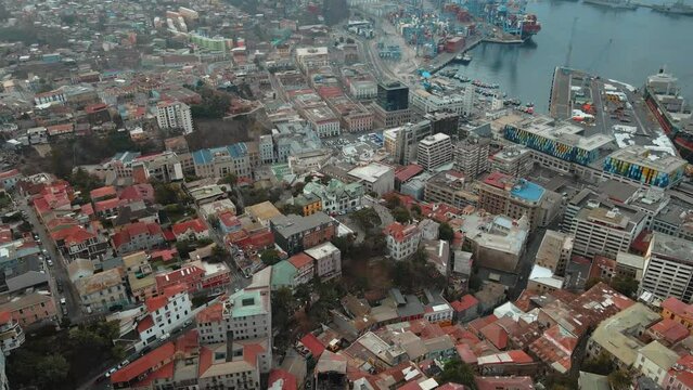 Aerial orbit of Baburizza Palace, Yugoslavian Walk and El Peral funicular in Cerro Alegre, Sea Port in the back, Valparaiso, Chile