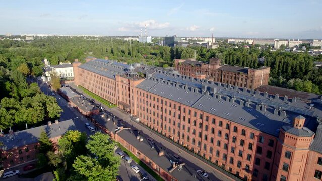 Ł&oacute;dź city on a sunny day. Characteristic places, buildings and streets. Piotrkowska Street from the bird's eye view.