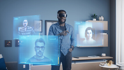 Afro-american man wearing VR goggles at online business meeting in meta universe cyberspace talking...