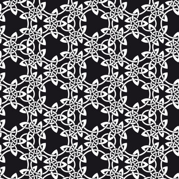 Seamless Celtic knot pattern including medieval crosses and circles in black and white (variation n° 5)