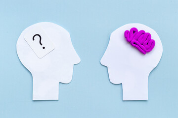 Contact between peolpe and communication. Brain on two paper human heads