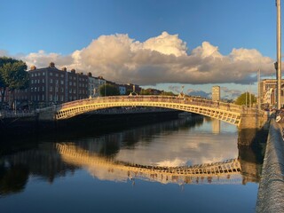 Ha penny bridge over the Liffey river at sunset, Dublin City, Ireland