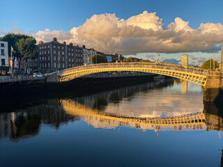 Ha penny bridge over the Liffey river at sunset, Dublin City, Ireland