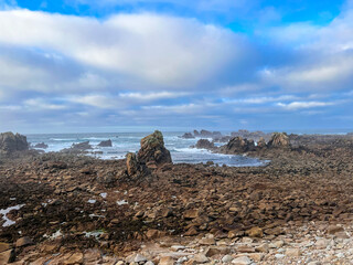 Fototapeta na wymiar Ushan countryside scenery with sea and skyline on background, Brittany, France
