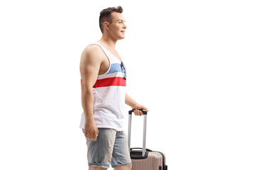 Young man with a suitcase going on a summer holiday