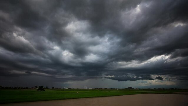 Dramatic low lying rumbly storm clouds rolling overhead as the south east Asia monsoon season sets in.