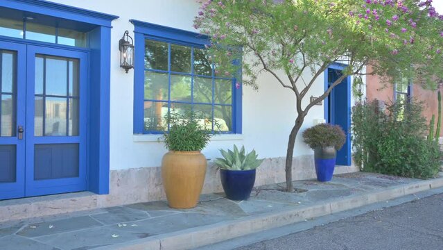 Colorful adobe homes in Tucson Arizona Barrio Viejo. Panning shot.
