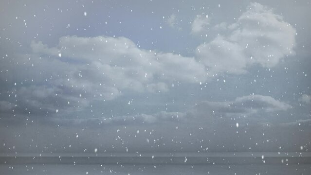 Animation of snow falling in seamless loop over clouded sky in background
