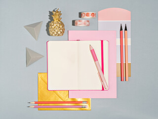 Top view of designers workplace with colour swatch and office supplies. Desk of artist or creative...