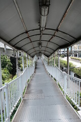 Fototapeta premium Pedestrian Bridge connecting Semanggi Bus Stop and Bendungan Hilir Bus Stop, taken on June 1, 2022 in Jakarta, Indonesia