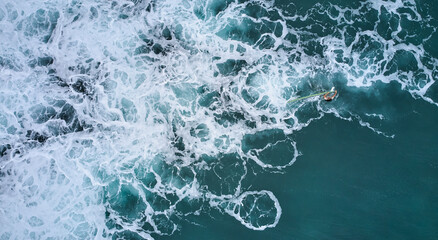 Aerial view of the ocean and surfer girl. Surfing in Midigama. Sri Lanka