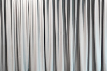 Light gray curtain background wallpaper. Abstract white fabric texture for decoration. Luxury vertical clean and smooth cloth backdrop. Home interior.