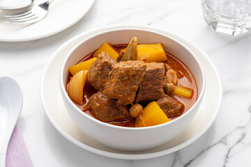 Thai beef massaman curry, one of the most popular Thailand’s signature gourmet dishes popularly served in Thai restaurants, in authentic Thai cooking style. 