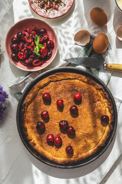Freshly baked cherry pie on table