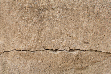 crack in the cement wall . A gray concrete wall floor. natural cement or stone old material use for design