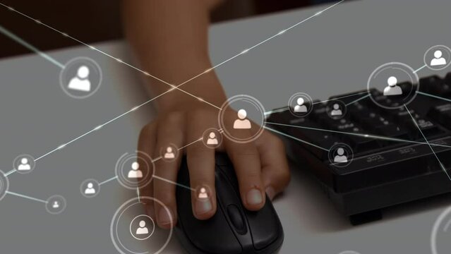 Animation of network of connections over hand of biracial pupil using computer mouse