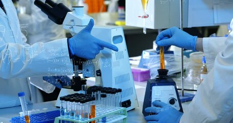 Animation of mathematical equations over group of diverse scientists in lab - Powered by Adobe