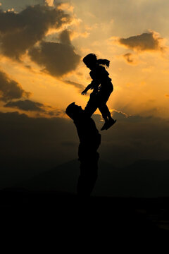 Happy mood dad  and daughter in the evening