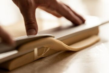 Cutting the dough for the preparation of Brioche feuilletée tressée pastry