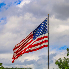 american flag against blue sky