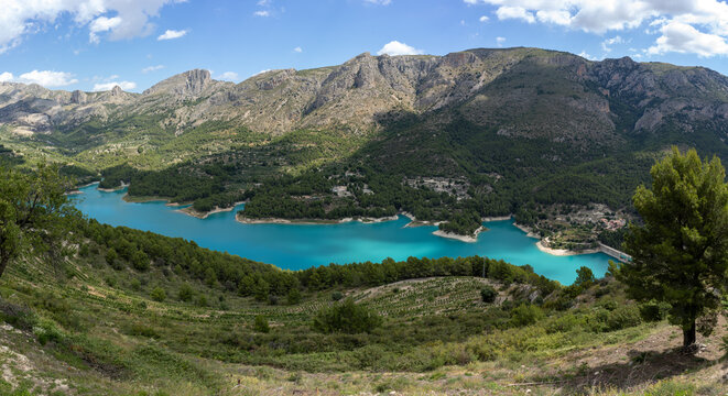 Panoramic view of the Guadalest reservoir with the Serrella mountain range in background in the province of Alicante, Spain