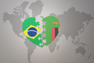 puzzle heart with the national flag of brazil and zambia on a world map background.Concept.