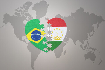 puzzle heart with the national flag of brazil and tajikistan on a world map background.Concept.