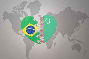 puzzle heart with the national flag of brazil and turkmenistan on a world map background.Concept.