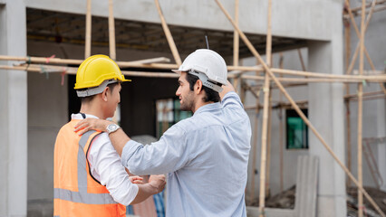 The engineer manager and foremen discussed and pointed to the site projects on the construction site to check the various functions.