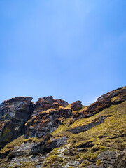 A beautiful view of rocks in the mountains with blue sky