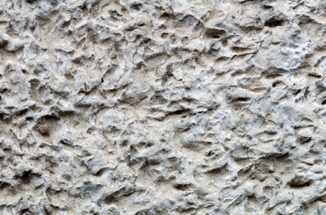 Gray facade plaster background. Monolithic stucco decorative background. Silicate-cement wall plaster.