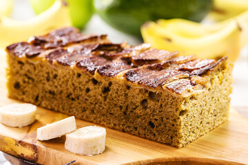 Homemade vegan banana cake, gluten and egg free, made without milk, with cinnamon, banana, fruit and oatmeal.