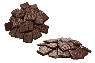 Dark chocolate candies isolated on white background.