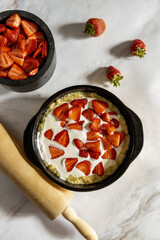 Fresh Homemade Fruit Tart with strawberry isolated on white table, top view.