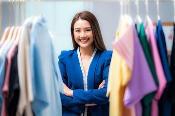 Naklejka na ściany i meble Attractive beautiful young business woman standing confident and feeling happy with business in