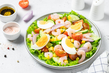 Shrimp egg salad salad on plate on light background. Copy space.