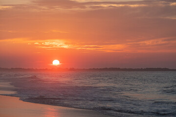 Ocean waves at sunrise off the shore of Cape May , New Jersey USA