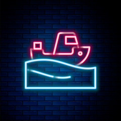 Glowing neon line Fishing boat on water icon isolated on brick wall background. Colorful outline concept. Vector