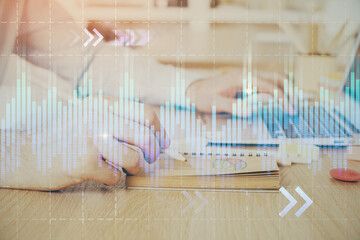 Multi exposure of financial graph with man works in office on background. Concept of analysis.