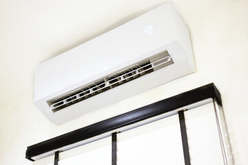 wall installed air conditioner make room cool low angle view