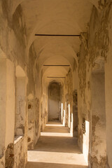 A covered colonnade in the medieval 12th century Beseno Castle in Lagarina Valley in Trentino,...